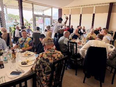 A lively group lunch fills a bright restaurant