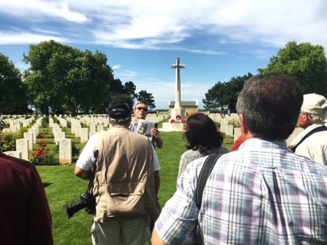 Visitors gather in a military cemetery